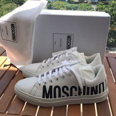 Moschino Low-Top Logo Sneakers Large Contrast Logo Is Printed At The Quarter Of These Low-Top Sneakers By Moschino. The Same Logo Is Embossed On The Midsole To Complete The Look. Polyurethane Upper Round Toe Lace-Up Style Rubber Sole Made In Italy Designer Low-top Custom Sneakers With Logo Print, Classic White Custom Sneakers With Logo Detail, Classic White Custom Sneakers With Logo, White Classic Custom Sneakers With Logo, Designer White Custom Sneakers With Embossed Logo, White Custom Casual Sneakers With Logo Detail, White Custom Sneakers With Logo Detail, Designer Custom Lace-up Sneakers With Logo Print, White Casual Custom Sneakers With Logo Detail