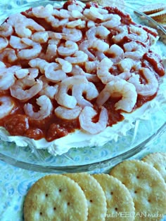 there is a cake with shrimp on it and crackers