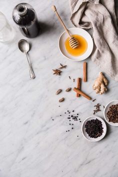 spices and tea on a marble counter top