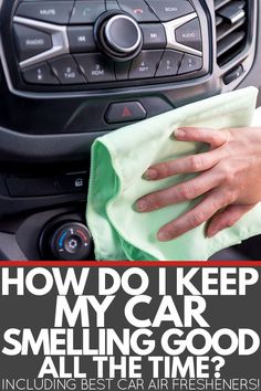 a person wiping up the dashboard of a car with a microfibrel cloth