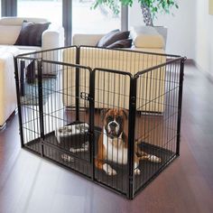 a dog is sitting in its cage on the floor