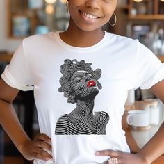 This Afrocentric Bantu Knots tee shirt steals the spotlight with an abstract line drawing that captures the beauty of a black woman adorned in her cultural crown of Bantu knots, her lips painted in a vibrant shade of red. The Bantu Knots tee is a conversation starter that weaves together culture, individuality, and heritage into an intricate pattern of self-love and community pride. Whether paired with jeans for a casual day out or dressed up with a blazer for an edgier look, the Afrocentric Ban Black Cowgirl, Bantu Knots, Edgy Look, Black Excellence, Style Noir, Shades Of Red, Look Plus, Black Tshirt, Black Tee