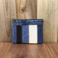 a small blue and white striped denim pouch