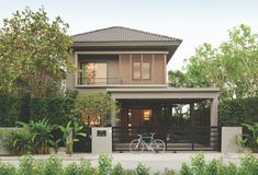 a bicycle is parked in front of a house with trees and bushes around the entrance