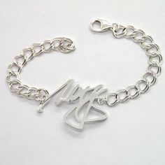 Sturdy sterling silver bracelet is a great personalized gift for men. Order your own message for this custom made bracelet, it will be made in a comfortably curved central piece with hefty chain and large lobster clasp. Depends on what you would like it to say, sterling silver center will be 1.5-1.8 in wide and 2.4mm thick - they are cast, not cut out of the metal sheet, which gives them extra sturdiness. If you would like to use handwriting, just send me a picture of it attached to the Etsy mes Engraved Sterling Silver Bracelet For Personalized Gift, Adjustable Name Bracelet With Polished Finish For Gifts, Adjustable Name Bracelet With Polished Finish, Personalized Silver Chain Bracelet As A Gift, Personalized Silver Chain Bracelet With Name, Personalized Name Charm Bracelet In Sterling Silver, Silver Name Bracelet With Polished Finish As Gift, Silver Name Bracelet With Polished Finish, Silver Sterling Silver Name Charm Bracelet