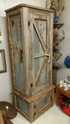 an old wooden cabinet sitting inside of a room