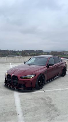 a red car parked in a parking lot