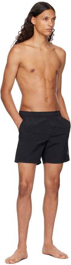 Crinkled ECONYL® regenerated nylon taffeta swim shorts. · Concealed drawstring at elasticized waistband · Three-pocket styling · Logo patch at front · Briefs-style nylon mesh lining Supplier color: Black Supplier code: 8115B0943 Nylon Swim Trunks With Drawstring And Relaxed Fit, Relaxed Fit Nylon Swim Trunks With Drawstring, Relaxed Fit Nylon Swim Trunks With Side Pockets, Athleisure Nylon Swim Trunks With Side Pockets, Nylon Beachwear Bottoms With Pockets, Beachwear Nylon Bottoms With Pockets, Nylon Beachwear Bottoms With Side Pockets, Beachwear Nylon Bottoms With Side Pockets, Sporty Nylon Swim Trunks With Side Pockets