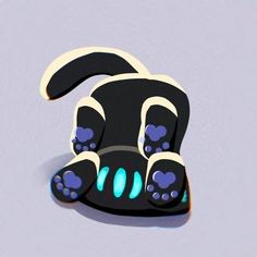 a black dog with blue eyes laying on its back and paw prints painted on it