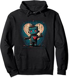 A unique, eye-catching piece that fuses the mystic charm of voodoo culture with a playful, animated twist. This cozy, unisex hoodie features a high-quality, digitally-printed design that showcases an enchanting voodoo-inspired cartoon character. The central figure, "Mojo," is a quirky, lovable character crafted with intricate details and vibrant colors. Mojo exudes an air of enchantment and mischief. Surrounded by a lively array of voodoo elements. Gothic Valentines Day, Merch Design, Voodoo Doll, Amazon Merch, The Mystic, Voodoo Dolls, Love Spell, Trending Products, Love Spells