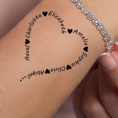 a woman's arm with the words i love you and hearts on it