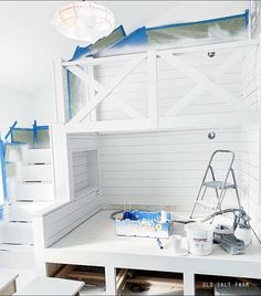 a room with white walls and blue paint on the ceiling