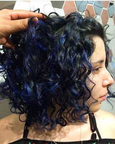 Blue Dyed Curly Hair, Blue Highlights In Brown Hair Curly, Curly Hair With Blue Highlights, Blue Short Curly Hair, Dark Blue Peekaboo Hair, Blue Highlights Curly Hair, Skunk Hair Curly, Curly Colored Hair, Curly Blue Hair