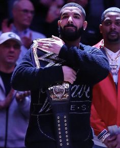 two men standing next to each other at a basketball game