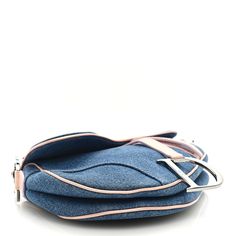 This is an authentic CHRISTIAN DIOR Patent Denim Jeans Saddle Bag in Blue and Pink. This shoulder bag is crafted of blue denim with pink patent stitching. The bag features a patent leather end to end looping pink shoulder strap with silver Dior initials links and patent leather border trim with a hanging strap and a silver "D" charm. The facing flap opens to a monogrammed navy blue fabric interior. Christian Dior Homme, Dior Coat, Navy Blue Fabric, Saddle Bag, Blue And Pink, Lady Dior, Flap Bag, Green Bag, Blue Bags