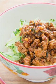 a close up of a bowl of food on a table