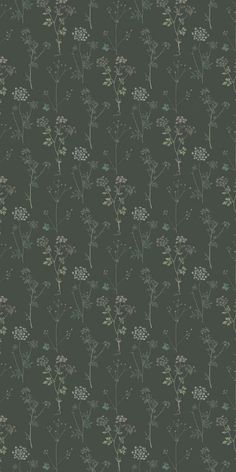 a green wallpaper with small flowers and leaves on the bottom half of it, against a dark background