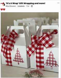 two white boxes with red and white checkered bows