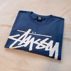 Stussy World Tour Tee Shirts Long Sleeve Midnight Blue 100%Cotton New Without Tags. Never Been Worn Out, Only Tried On Once. Has A Small Print Crack On The Front Logo Of The Shirt. Rare Shirt And Sold Out Quick In This Size. Open To Offers. Branded Blue Summer Tops, Summer Blue Tops With Branding, Blue Cotton Tops With Branding, Stussy World Tour, Wishlist 2024, Shirts Long Sleeve, Long Sleeve Tee Shirts, Small Print, Christmas Wishlist