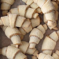 there are many pieces of bread that have been cut into small squares and placed on a table