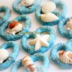 some cookies are decorated with shells and starfishs