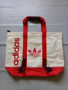 Rare item. Vintage adidas beg Made in japan Size 20x17 snap button Zipper and pocket Condition is good. Only one available And hard to come back. Adidas 2000 Vintage, Casual Adidas Logo Bags For Everyday Use, Casual Adidas Sports Bags, Adidas Duffle Bag, Soccer Bag, Adidas Art, Adidas Bags, Accessory Ideas, Adidas Vintage