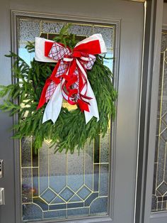 a wreath on the front door of a house