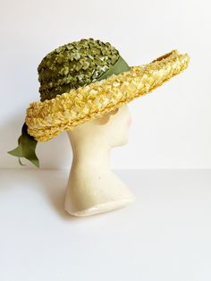 Lovely midcentury summer hat - Wide, upturned yellow straw brim - Tall green straw crown wrapped with matching green grosgrain ribbon - Bow at back - Grosgrain ribbon band inside - Label: Reproduction of Paulette Retro Green Hat For Vacation, Brimmed Straw Hat With Ribbon For Garden Party, Green Fedora Straw Hat For Kentucky Derby, Green Brimmed Straw Hat For Garden Party, Green Straw Hat For Kentucky Derby Beach, Green Straw Hat For Kentucky Derby Vacation, Green Boater Hat With Curved Brim For Summer, Green Brimmed Boater Hat For Summer, Green Straw Sun Hat With Curved Brim