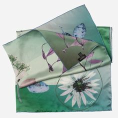 This exquisite pressed flower print, blossoming in rich tones of greens, blues and violet, captures the serene beauty of an Italian garden in full bloom. I designed this scarf for the woman who loves surrounding herself with beautiful things. The way the colors dance in the light—it’s an accessory that feels as special as you are. Details Classic foulard size: Approx. 35" x 35" (90 x 90cm). Once made famous by the likes of Audrey Hepburn, Sophia Loren and Grace Kelly, a foulard will always add a Elegant Green Floral Silk Scarf, Elegant Green Floral Print Silk Scarf, Green Bohemian Silk Scarf With Floral Print, Artistic Floral Print Scarves For Spring, Artistic Green Silk Scarf With Floral Print, Green Floral Print Scarf For Gift, Green Floral Print Scarves As Gift, Laurel Green, Green With Blue