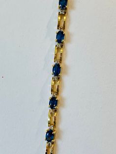 Beautiful Vintage 14K Yellow Gold Diamond and Oval shape Sapphire Bracelet: Stunning Genuine Diamonds and Natural Oval Sapphires Sapphire(s): 11 pc 8.0 CT Diamond(s): 0.20 CT Color: F Clarity: SI1 Total Bracelet Weight: 11.1 GR Bracelet Length: 7in Bracelet Width: 5 mm 14K Yellow Gold For more information regarding this item feel free to reach me so I can accommodate your needs. Thank you 14k Gold Tennis Bracelet With Gemstones For Formal Occasions, Formal Gold Gemstone Tennis Bracelet, Formal Oval Gold Bracelet With Diamond Accents, Blue Gold Bracelet With 17 Jewels For Formal Occasions, Gold Oval 14k Gold Tennis Bracelet, Gold Oval Tennis Bracelet In 14k, Gold 14k Oval Tennis Bracelet, Formal Gold Diamond Bracelet With Gemstone, Gold Diamond Bracelet With Gemstone For Formal Occasions