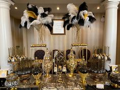 a table topped with lots of gold and black items