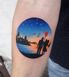 a person with a tattoo on their arm that has an image of a man and woman