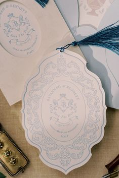 some blue and white paper on top of a table with other items around it,