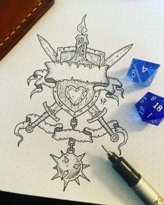 a pen and some dice sitting on top of a paper