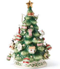 a ceramic christmas tree with ornaments on it