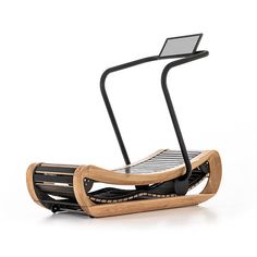 a wooden and metal chair with a laptop on it's back end, in front of a white background