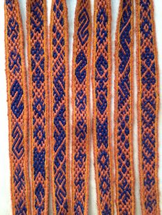 several orange and blue braids on a white surface