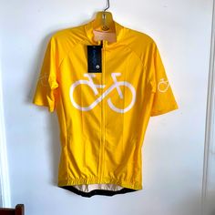 a yellow bicycle jersey hanging on the wall