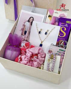 a gift box filled with jewelry and personal care items for the woman in your life