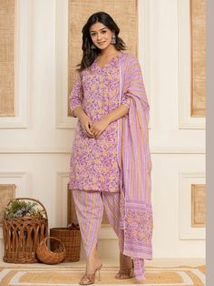 This 3-piece set includes purple & yellow floral print straight shape kurta has round-neck, 3/4th sleeves, straight hem, knee length teamed with printed dhoti pants with elasticated waistband & slip on closure and a dupatta. The model wearing the size small is 5'8 in height. 3 Piece Set Color-Purple & Yellow Suit Fabric- Cotton Dupatta Fabric-Cotton Work - Floral Print detailing Neck - V Neck Sleeves - 3/4th sleeves Length-Knee Length Bottom - Printed Trouser Bottom - Elasticated Waistband & Slip-on Closure Washing Care-Hand Wash The model height 5'8 is wearing a size small Purple Straight Kurta With Printed Motifs, Fitted Purple Kurta With Printed Motifs, Purple Straight Kurta Set For Diwali, Traditional Purple Printed Lawn Suit, Purple Cotton Dupatta For Eid, Traditional Purple Lawn Suit For Summer, Spring Unstitched Purple Salwar Kameez, Purple Cotton Lawn Suit With Printed Motifs, Purple Salwar Kameez With Printed Motifs For Diwali