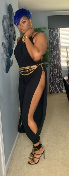 Hey sis! If you want a jumpsuit that will turn heads then this is it. Perfect for a night out or date night. Very sexy with splits at the legs. Comes with a black matching belt (chain belt pictured on model not included). Has halter tie style neckline. Fits true to size. Model wearing size large. 95% rayon and 5% spandex Edgy Bottoms With Belt For Party, Edgy Party Bottoms With Belt, Trendy Split Bottoms For Party, Trendy Party Bottoms With Split Design, Trendy Party Bottoms With Split, Fitted Jumpsuits And Rompers With Split For Party, Fitted Split Jumpsuits And Rompers For Party, Fitted Body Chain For Night Out In Summer, Fitted Body Chain For Summer Night Out