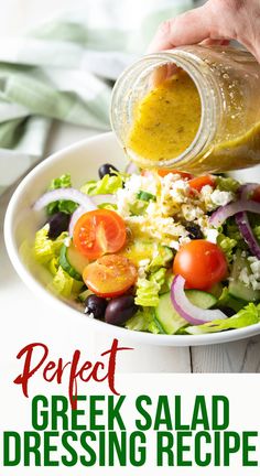 a person pouring dressing into a salad in a white bowl