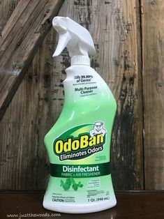 a bottle of odoban disinfectant on a wooden surface