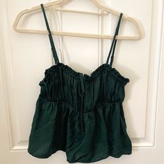 Deep Emerald Green Camisole Top With Adjustable Spaghetti Straps. Size Small, Never Worn. Bow Detail On Front. Forest Green Tops, Green Vacation Top With Built-in Bra, Green Tops With Built-in Bra For Spring, Green Cotton Camisole With Tank Straps, Green Sleeveless Camisole With Straps, Green Sleeveless Crop Top With Straps, Summer Vest Top With Spaghetti Straps, Summer Crop Top With Spaghetti Straps, Summer Spaghetti Strap Crop Top Vest