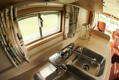 a kitchen sink and window in a small home