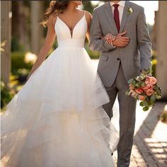 a bride and groom are walking together