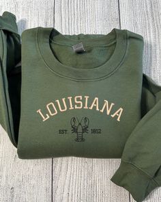 Louisiana Embroidered sweatshirt Trendy Street Style, Embroidered Crewneck, Embroidered Sweatshirt, Embroidery Ideas, Embroidered Sweatshirts, Text Design, Casual Elegance, Christmas Sweatshirts, Gift Christmas