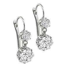 This is a gorgeous pair of platinum earrings. The earrings feature sparkling 2 large old mine cut diamonds that weigh approximately 3.12ct. The color of the diamonds is I-J with VS clarity. The 2 large diamonds are accentuated by dazzling old mine cut diamonds that weigh approximately 0.81ct. The color of these diamonds is G with VS clarity. The total weight of the diamonds is approximately 3.93ct. The earrings measure 23.5mm by 8mm and weigh 5.6 grams. Diamond Dangling Earrings, Platinum Earrings, Dangling Earrings, Wedding Shop, Favorite Things Gift, Jewelry Earrings Dangle, Diamond Cuts, Etsy Earrings, Dangle Drop Earrings