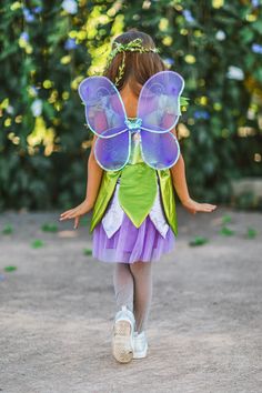 *Please refer to size chart for the best fit* Fairy princess costume is a perfect pick for Halloween & Dress Up Dress features a flower fairy bodice with a green leaf inspired skirt Purple wings & flower crown add the perfect fairy touch Wings attach at shoulders for a cape-like design Bring your little ones dreams of being a fairy to life with our beautiful Fairy Princess Costume. The sleeveless dress features a sweet flower bodice with a leaf inspired metallic skirt and looks perfect paired with the purple wings and matching flower crown. The stretchy fabric with soft lining ensures all day comfort, while the side zipper makes for easy dressing. She can pair this costume with our matching Silver Glitter Stockings for the complete look! bullets:Includes: Dress, Wings & Headband 100% Polye Glitter Stockings, Fairy Princess Costume, Purple Wings, Beautiful Fairy, Skirt Purple, Princess Costume, Butterfly Fairy, Metallic Skirt, Fairy Princess