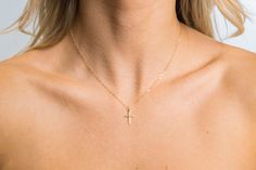 Show off this beautiful gold filled patterened cross that hangs from a dainty shimmering 14k gold filled chain and finished off with a 14k gold filled round spring clasp. Very sparkly and shimmery. Great to wear on its own or for necklace layering. Makes the perfect gift for a loved one or yourself! ITEM DETAILS * * 14k Gold Filled/Sterling Silver Cross 10.2x16.4mm * * 14k Gold Filled/Sterling Silver flat cable chain *Picture Size: 16 inches (Picture 2) All of the components in this piece are 14 Dainty Yellow Gold Cross Necklace With Adjustable Chain, Gold Cross Charm Necklace In 14k, Gold Crucifix Charm Necklace In Minimalist Style, Gold Minimalist Crucifix Charm Necklace, 14k Gold Filled Cross Jewelry Gift, Minimalist Gold Crucifix Charm Necklace, Delicate Clavicle Chain Jewelry With Cross Pendant, Gold Minimalist Cross Pendant Jewelry, Delicate Cross Jewelry Gift